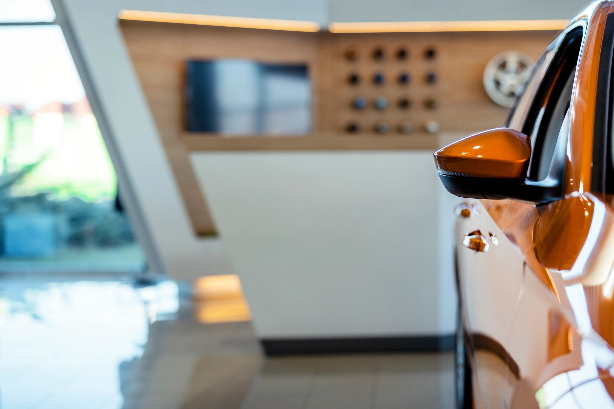 Vehicles displayed in a modern dealership showroom