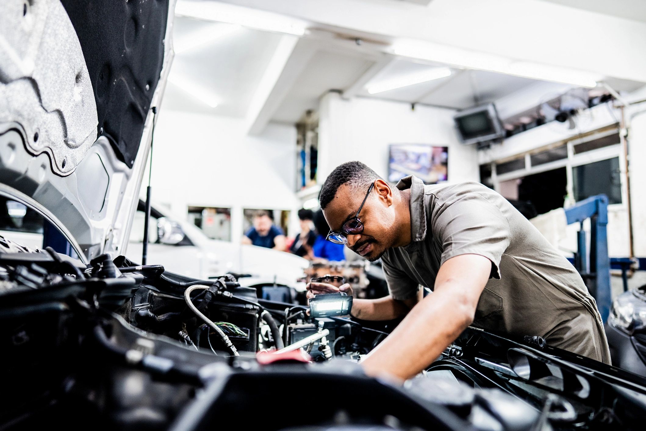 Automotive technician working on a vehicle repair